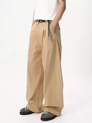 Relaxed wide-leg khaki sweatpants with front pleats and a braided belt detail.