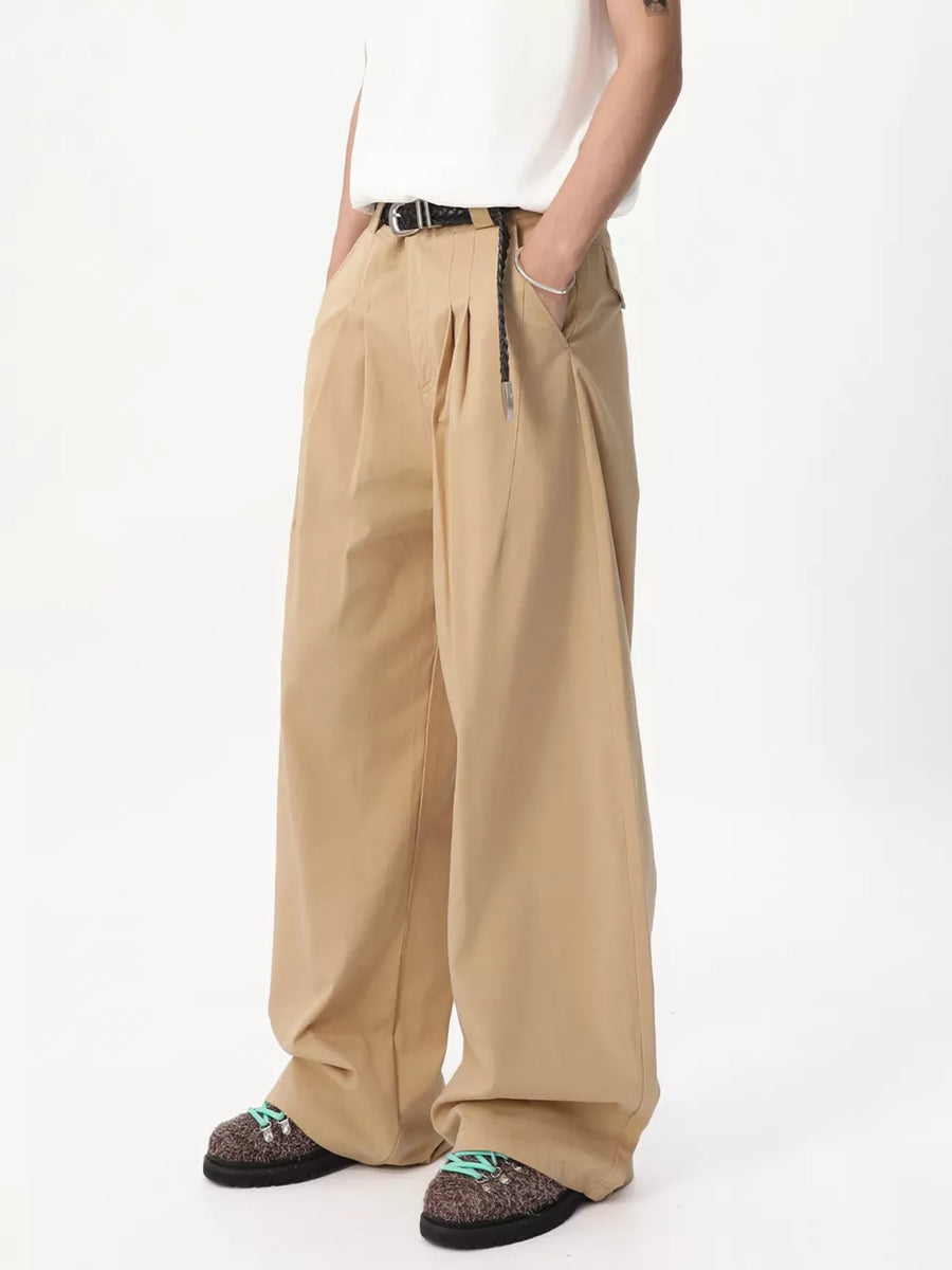 Relaxed wide-leg khaki sweatpants with front pleats and a braided belt detail.
