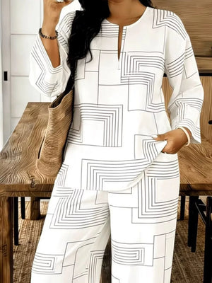 White geometric print two-piece set with split neck tunic and wide-leg pants.
