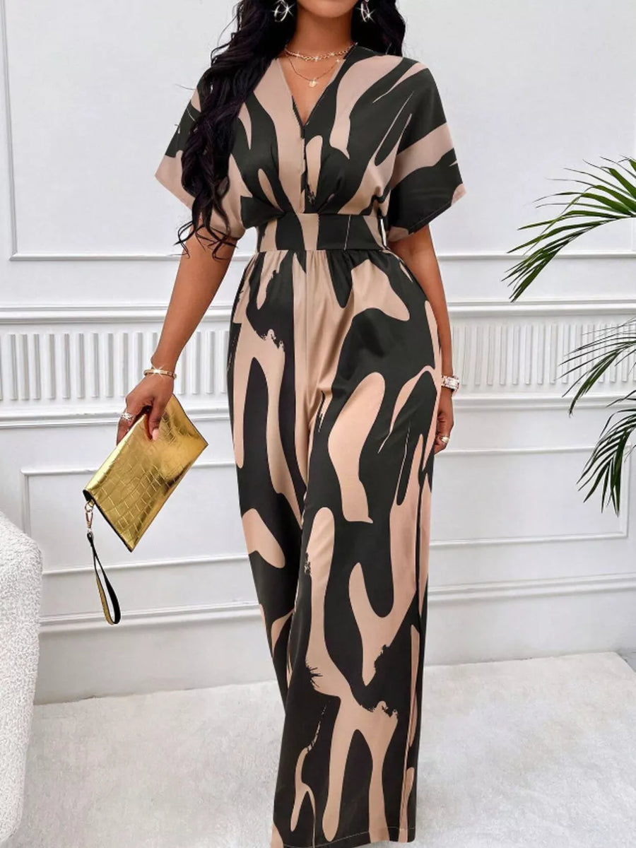 Chic abstract print wide-leg romper in black and khaki with V-neck and short sleeves.