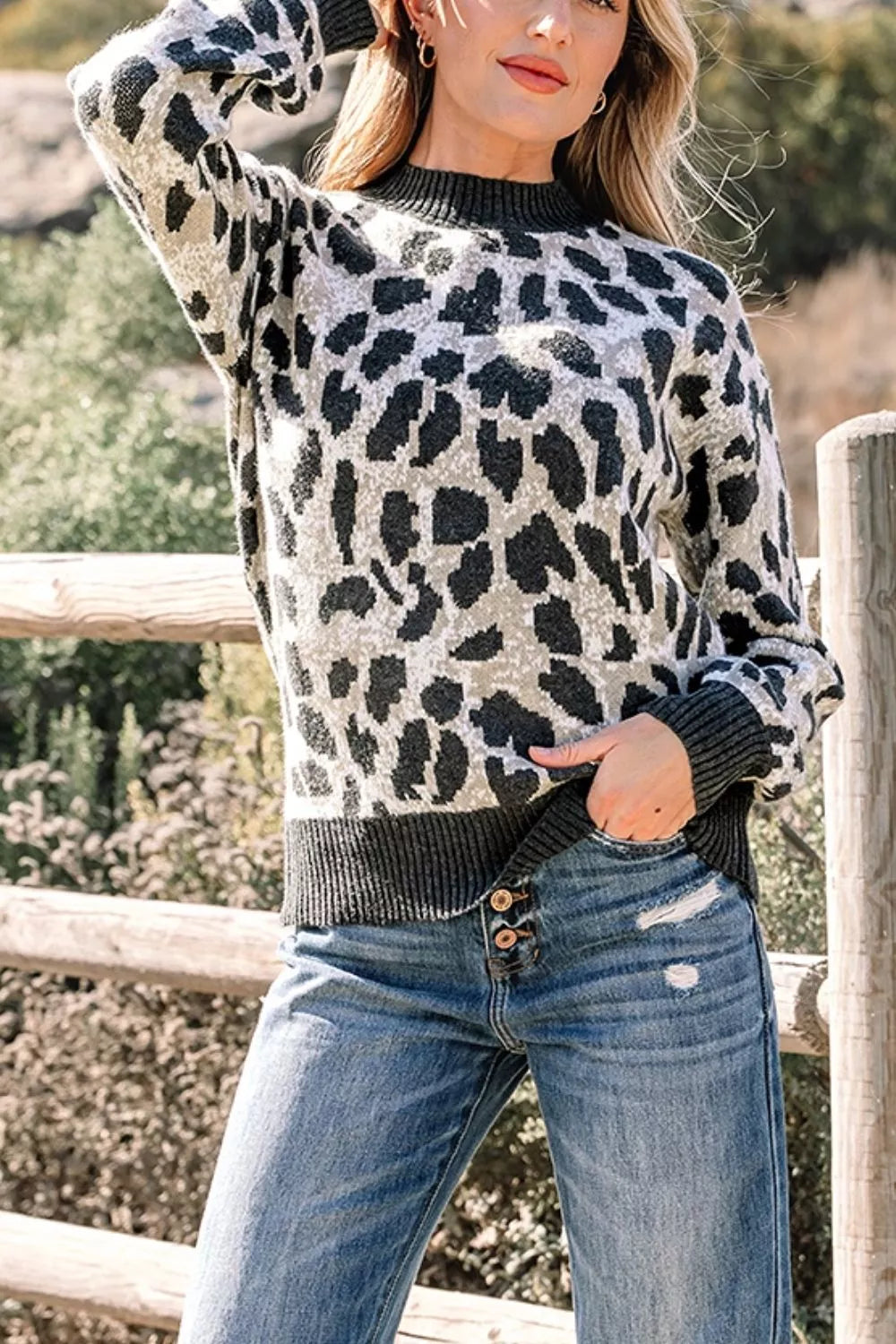 light grey pullover sweater featuring oversized and leopard-print