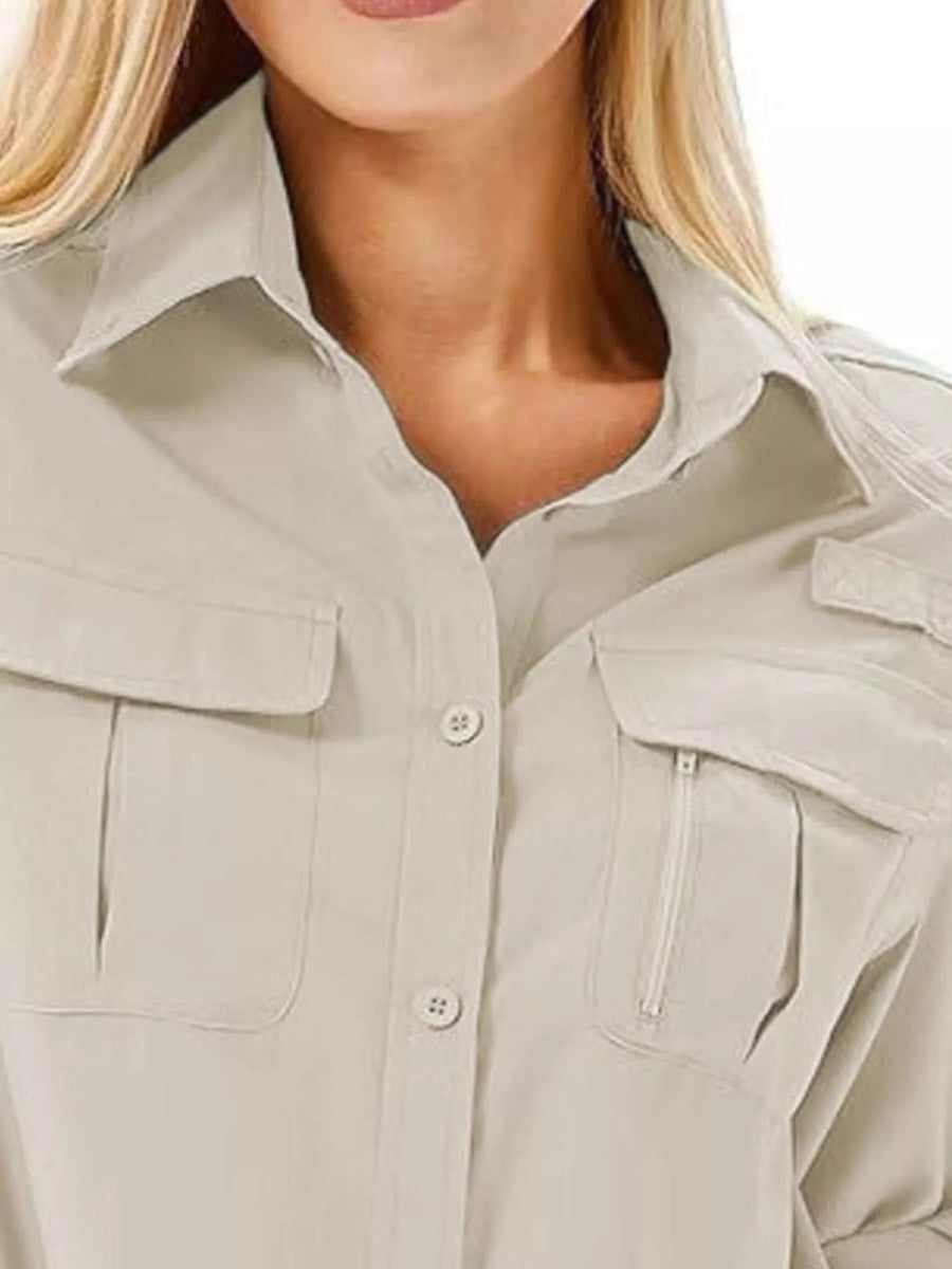 Light gray button-up shirt with chest pockets and roll-up sleeves.