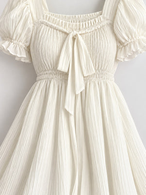cream mini dress with smocked and puff sleeve