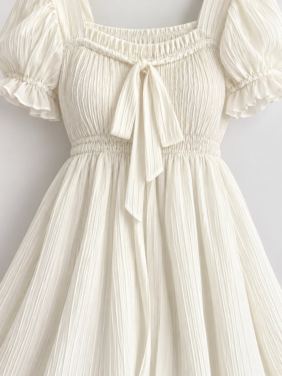 cream mini dress with smocked and puff sleeve