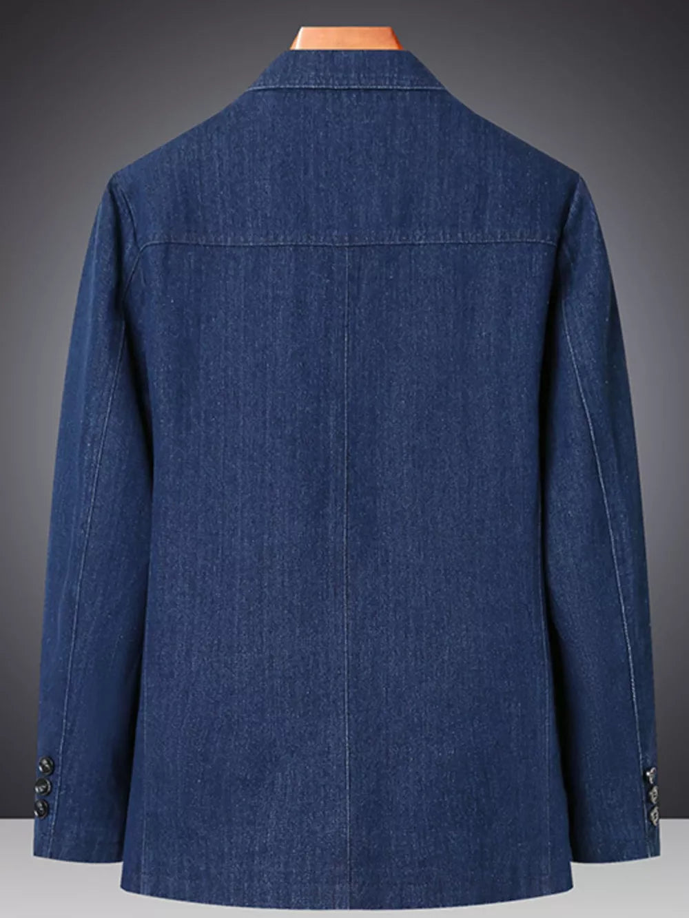 Textured dark blue denim blazer with notched lapels and buttoned cuffs.