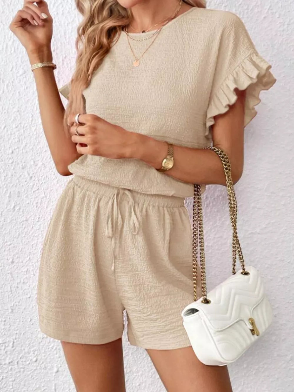 Beige frill sleeve tee and drawstring shorts set with textured fabric.