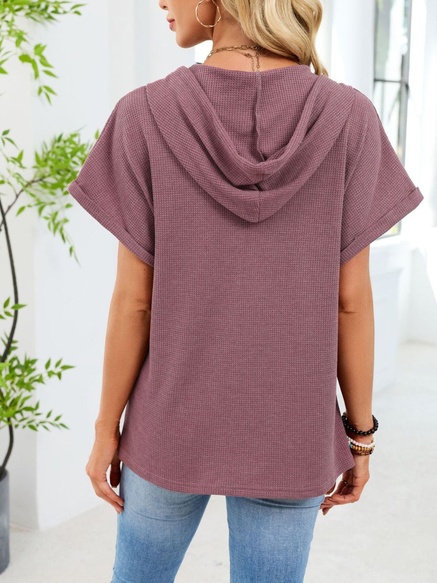 Waffle knit short sleeve hooded top in brick red with rolled cuffs.