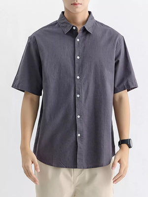 Dark Gray cotton short sleeve button-up shirt with white buttons.