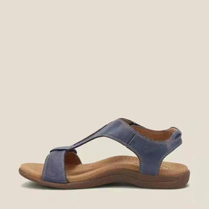 Navy leather T-strap comfort sandals with a contoured footbed and adjustable ankle strap.
