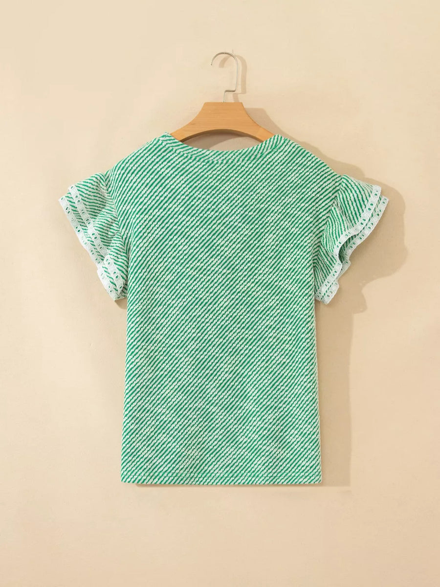 Women's green and white striped cotton blouse with ruffle trim sleeves.