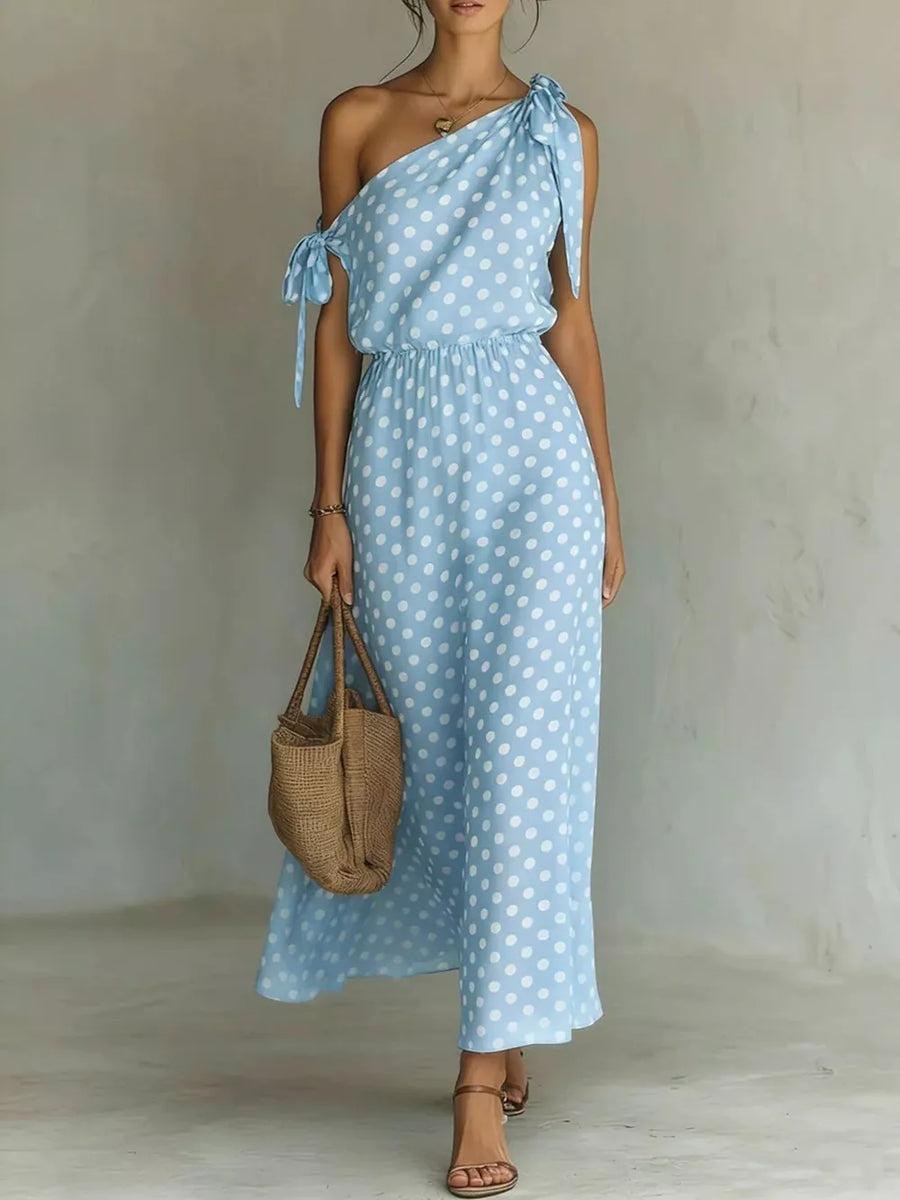 Blue polka dot one-shoulder maxi dress with tie details and elastic waist