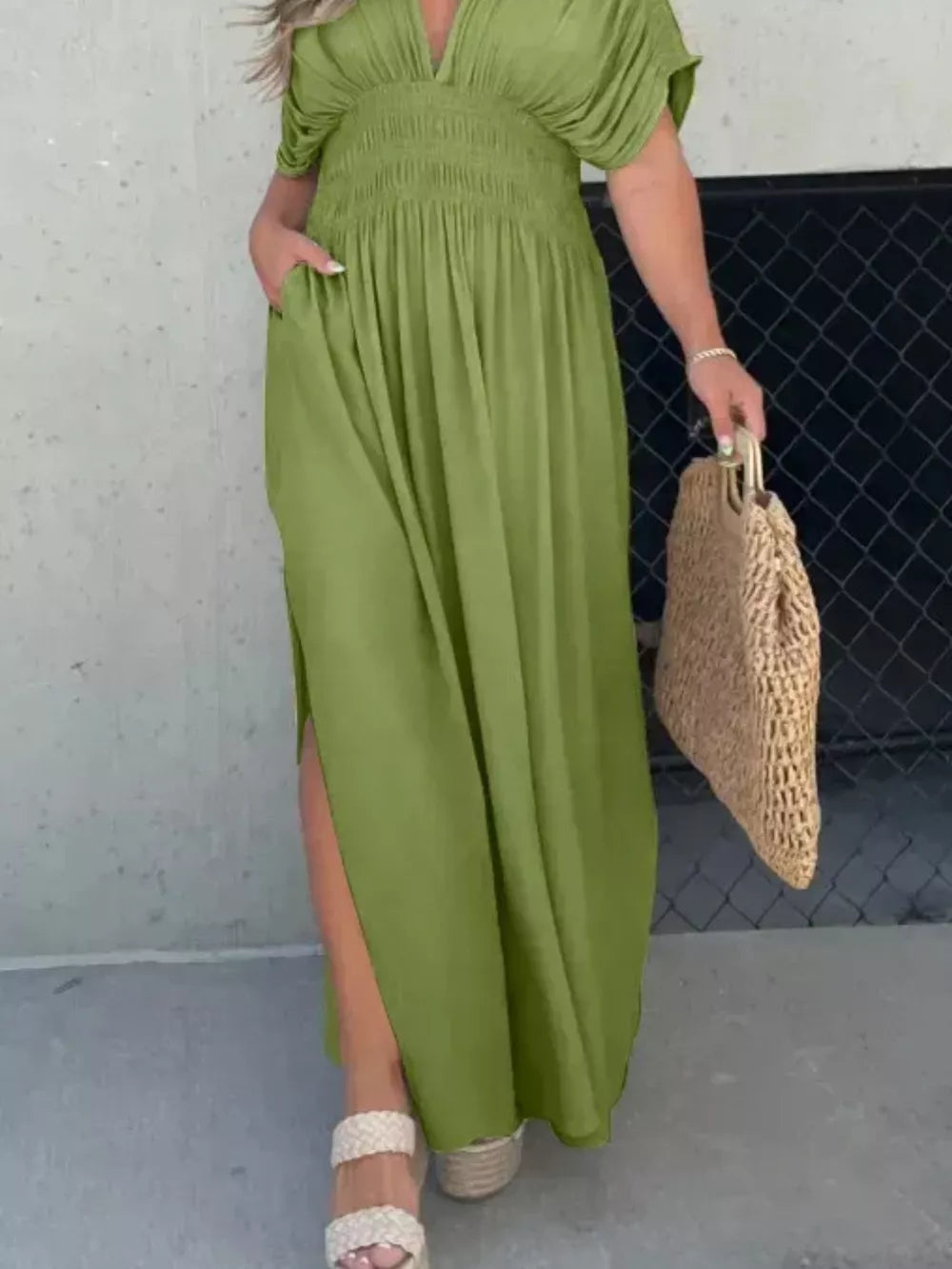 Matcha green V-neck maxi dress with smocked waist, dolman sleeves, and side slits.