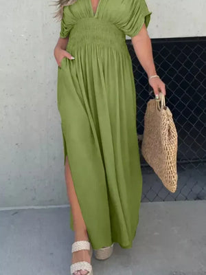 Matcha green V-neck maxi dress with smocked waist, dolman sleeves, and side slits.