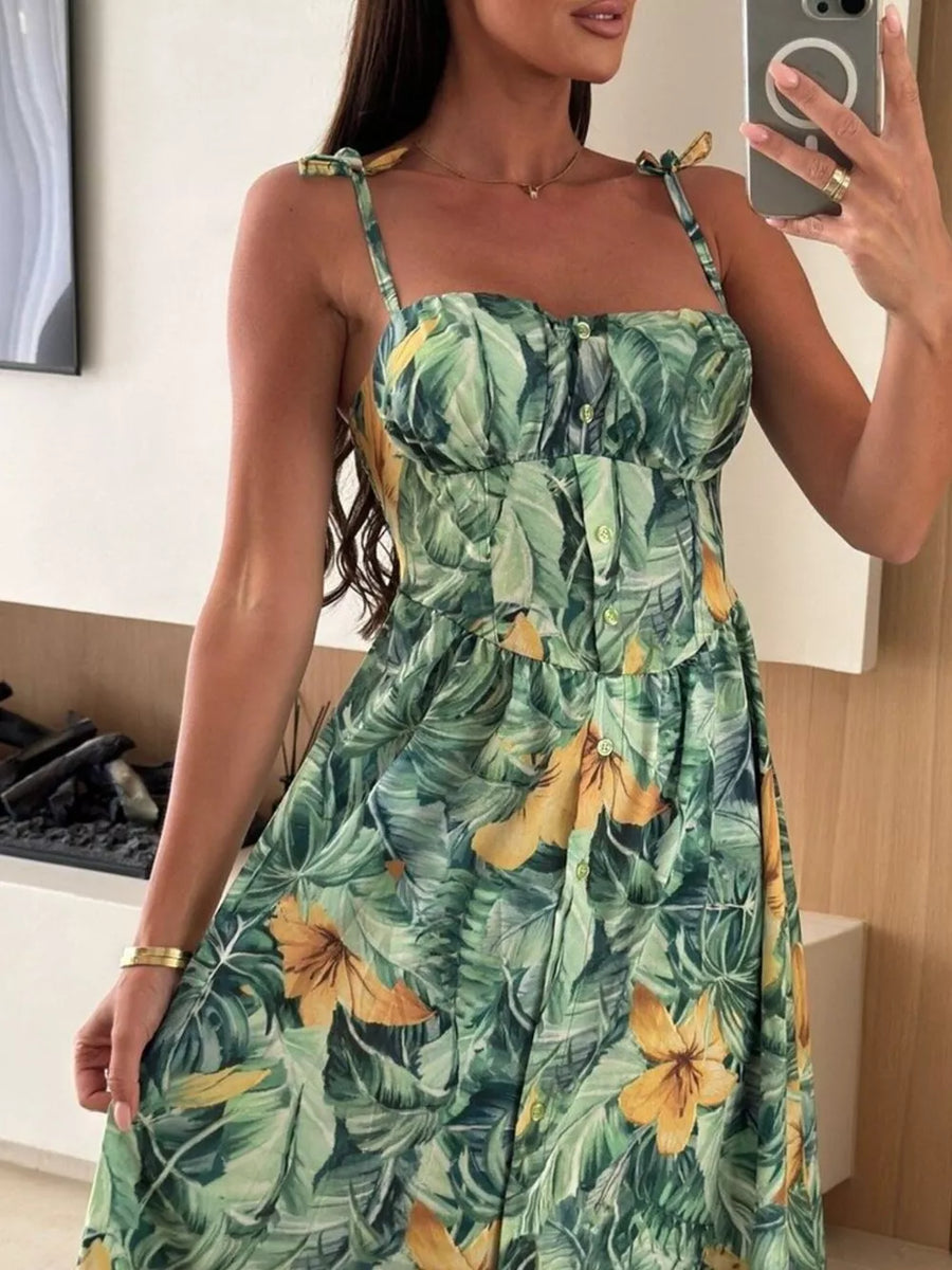Floral tie-strap midi dress in Matcha Green with a tropical leaf and flower print.
