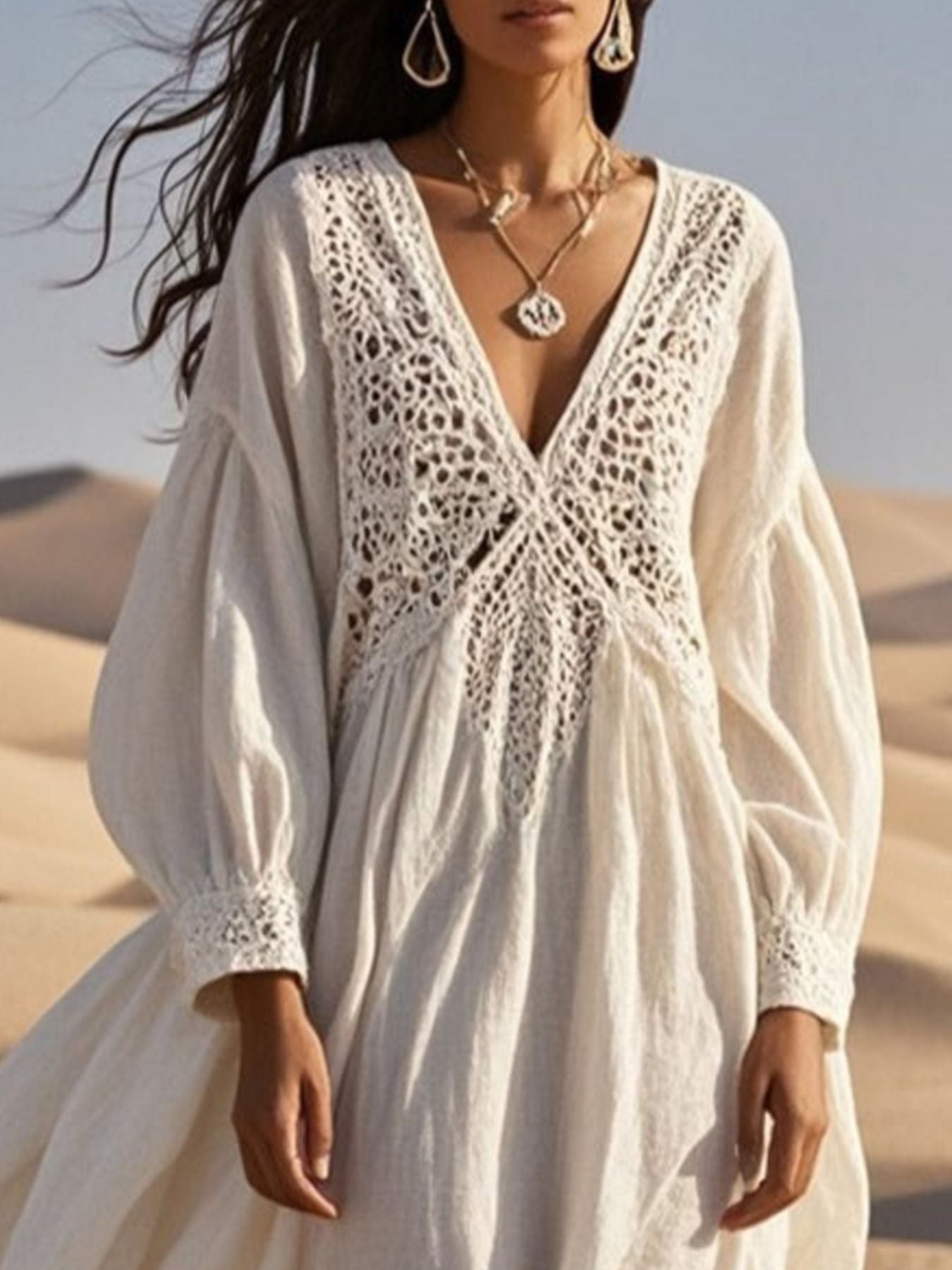 White crochet lace V-neck midi dress with balloon sleeves and cutout detail.