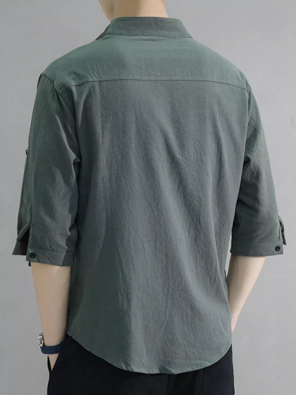 Men's army green cotton button-down shirt with roll-up sleeves and chest pocket.
