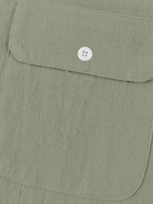 Military green cotton short-sleeve shirt with band collar and button-down chest pocket.