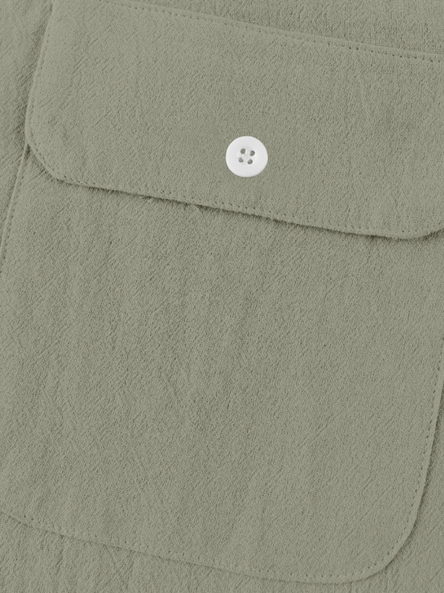 Military green cotton short-sleeve shirt with band collar and button-down chest pocket.