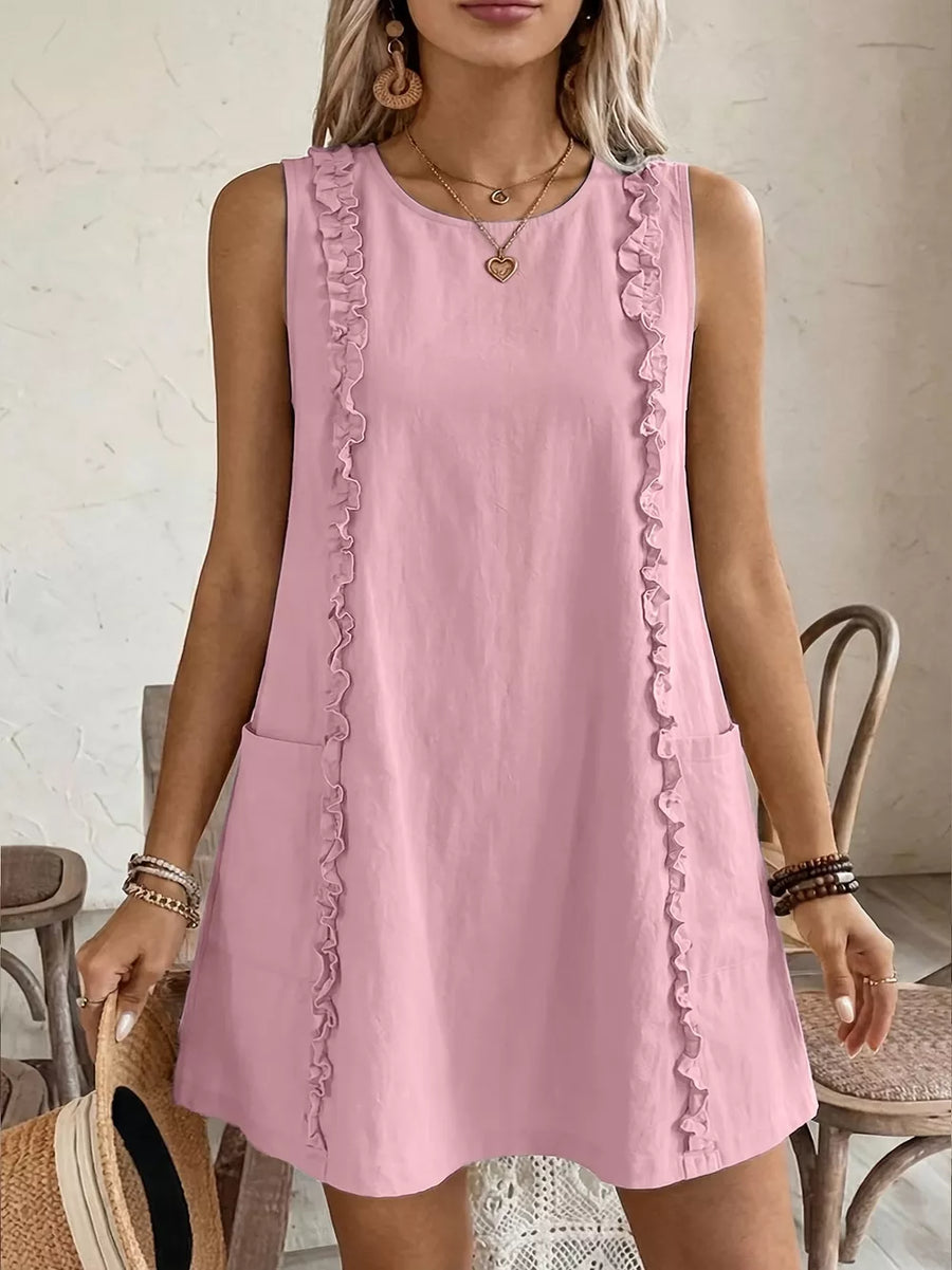 Blush pink sleeveless dress with frill trim and pockets.