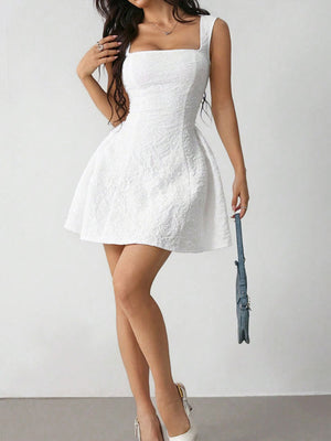 White textured square neck mini dress with a fitted bodice and a-line skirt.