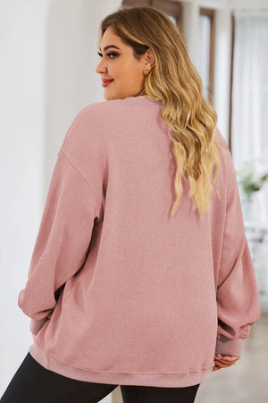 Dusty Pink ribbed crewneck sweatshirt with a relaxed fit and crew neckline.