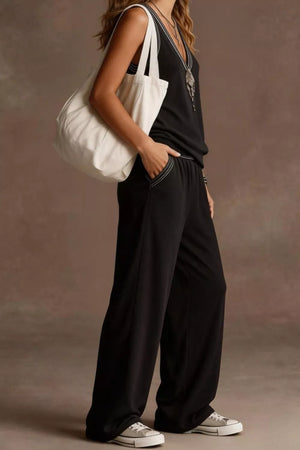 Black V-neck tank and wide-leg pants set with white contrast stitching and elastic waist.