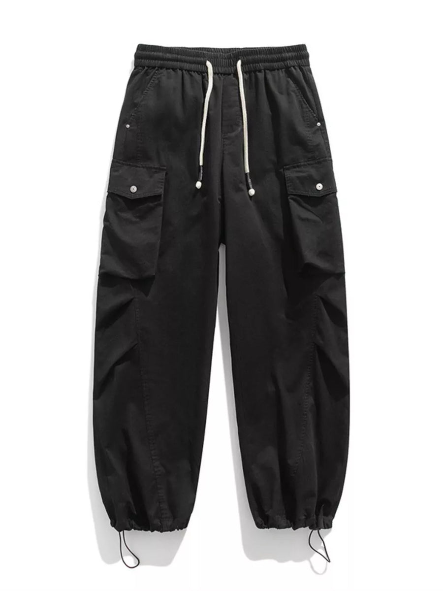 Black cargo pants with drawstring waist and hem, featuring button-flap pockets.