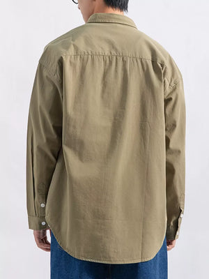 Men's long sleeve button-up shirt in apricot with a classic collar and buttoned cuffs.