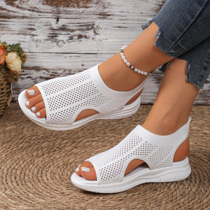 Modern mesh open-toe sandals in white with a chunky sole and breathable knit upper.