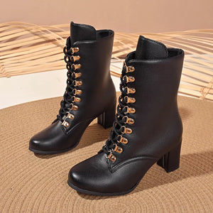 Black lace-up block heel boots with gold eyelets and laces.