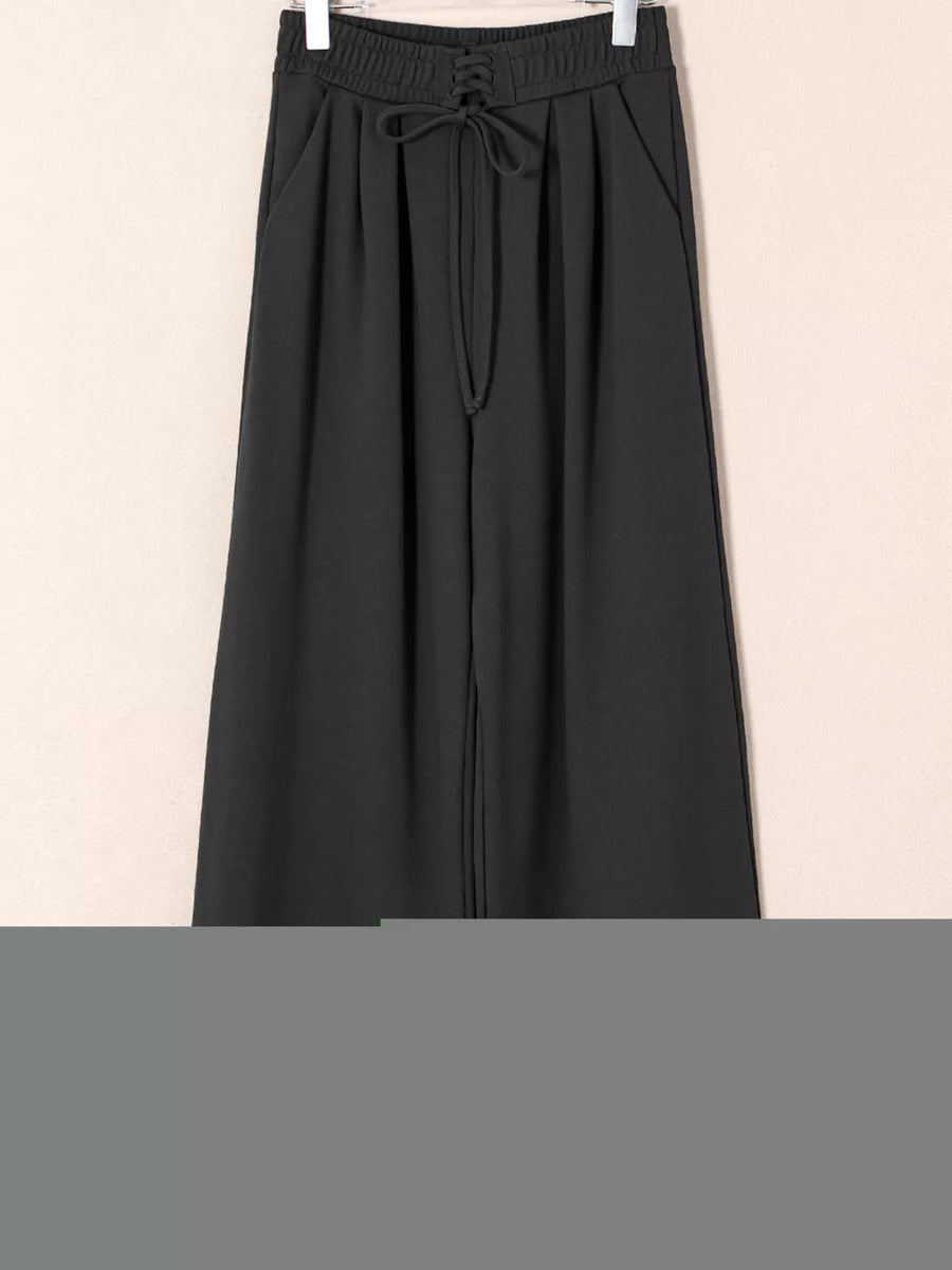 Black cotton maternity pants with drawstring high waist and pleats