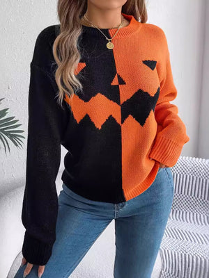 orange pullover sweater with graphic and crew neck