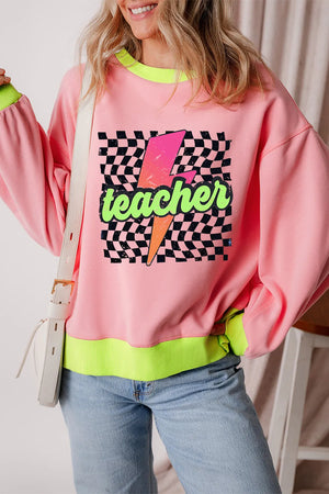 Pink graphic sweatshirt with neon trim and checkerboard lightning bolt teacher graphic.