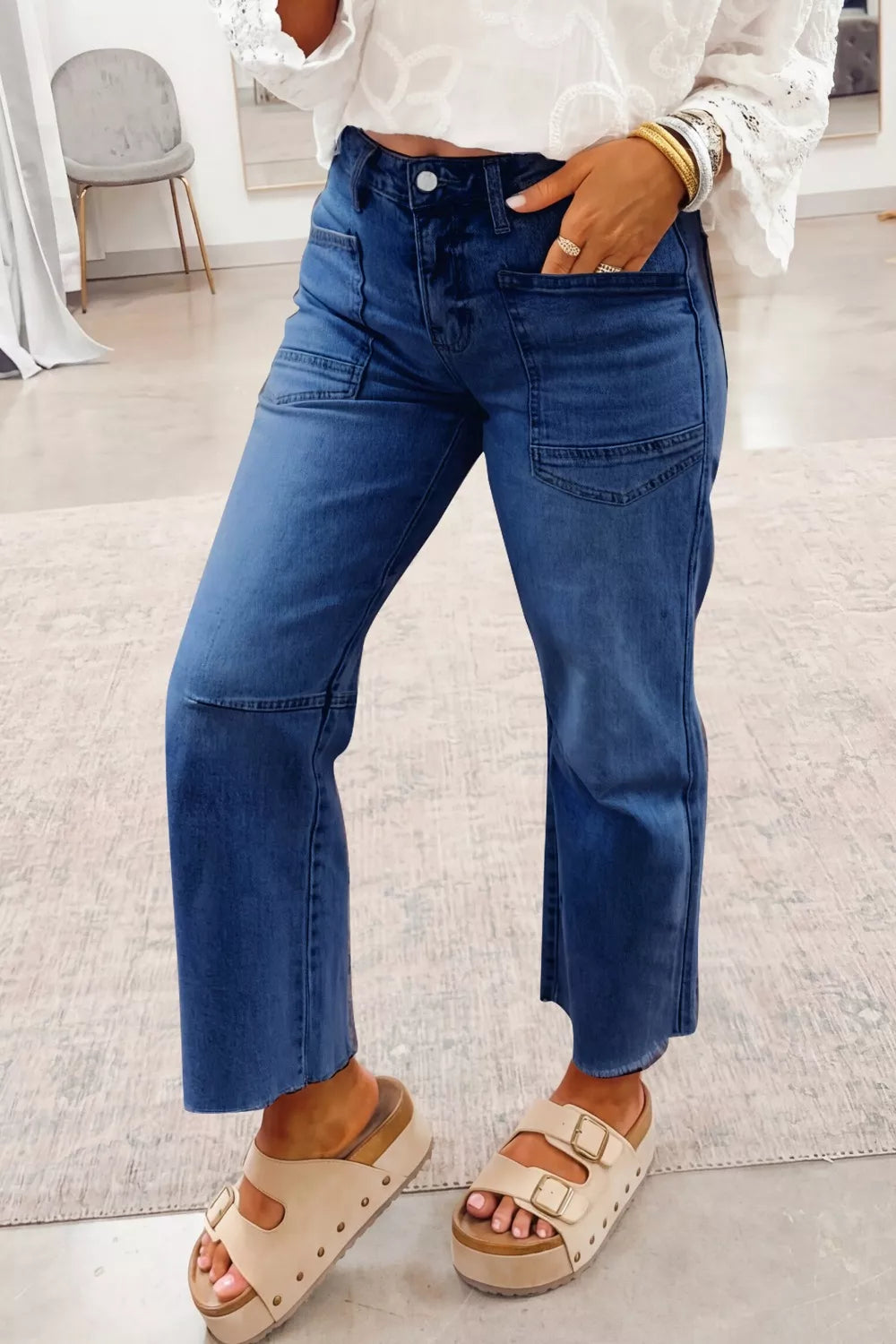 Dark blue denim maternity jeans with straight leg and utility pockets.