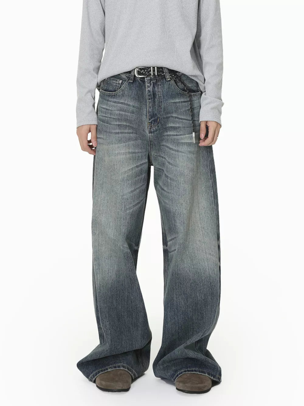 Men's wide leg denim jeans in washed blue with a relaxed fit and gradient fade.