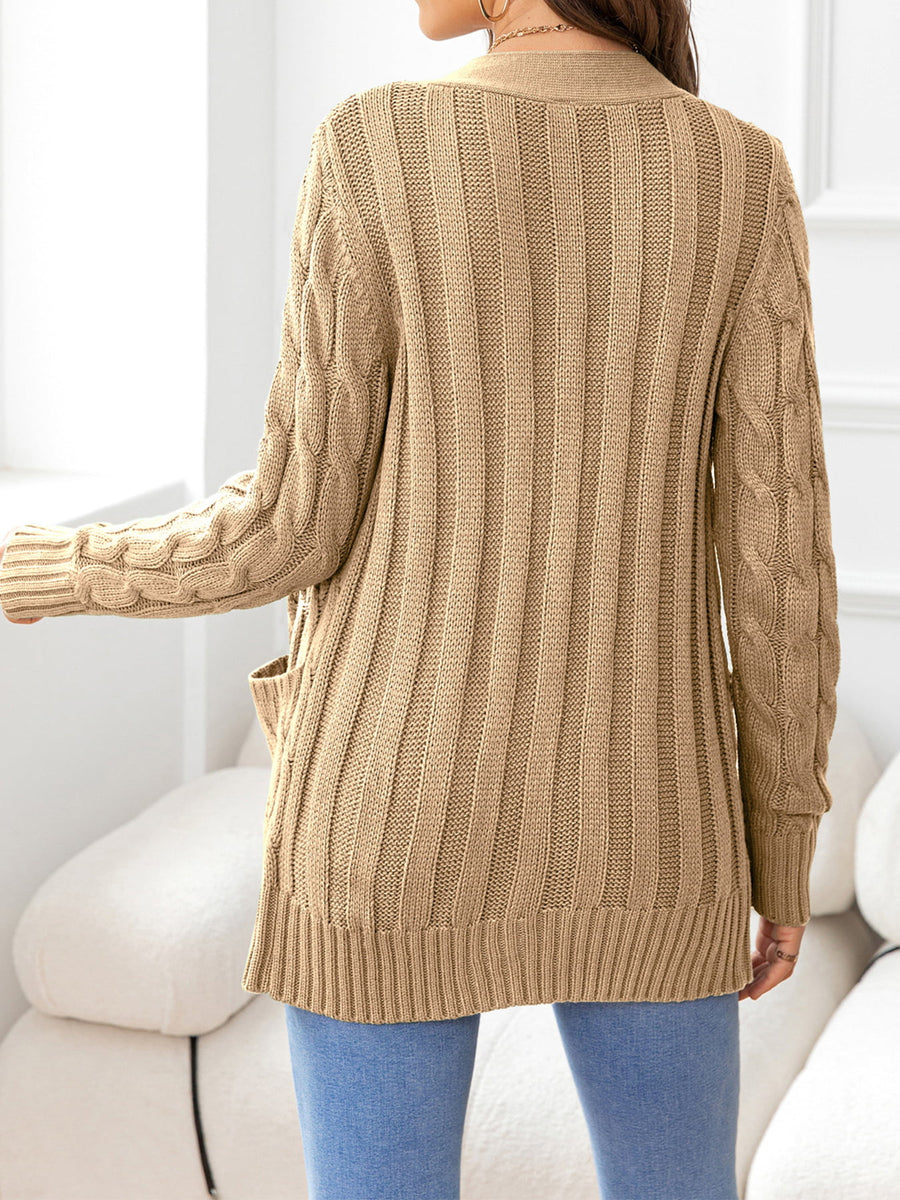 Camel knit cardigan with cable sleeves and ribbed texture.