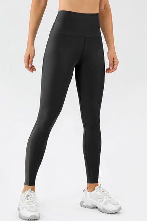 Black high-waist performance leggings with sculpted side panels.