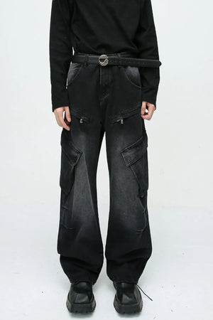 Baggy black denim cargo pants with zipper pockets and large side pockets.
