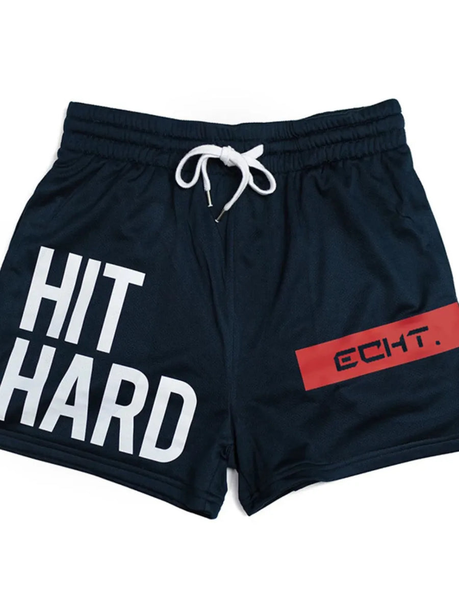 Navy mesh training shorts with white "HIT HARD" graphic and red "ECHT." logo detail.