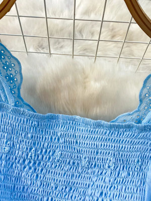 Blue eyelet maxi dress with smocked bodice and cutout detail