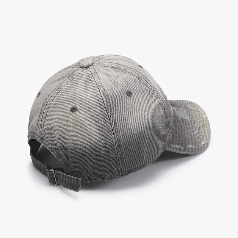 Distressed gray cotton baseball cap with adjustable strap and faded details.