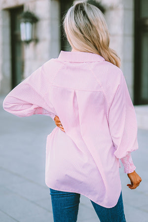 Blush pink pinstripe blouse with balloon sleeves and smocked cuffs.