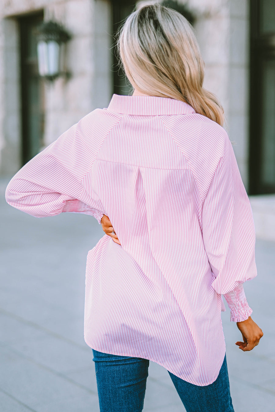 Blush pink pinstripe blouse with balloon sleeves and smocked cuffs.