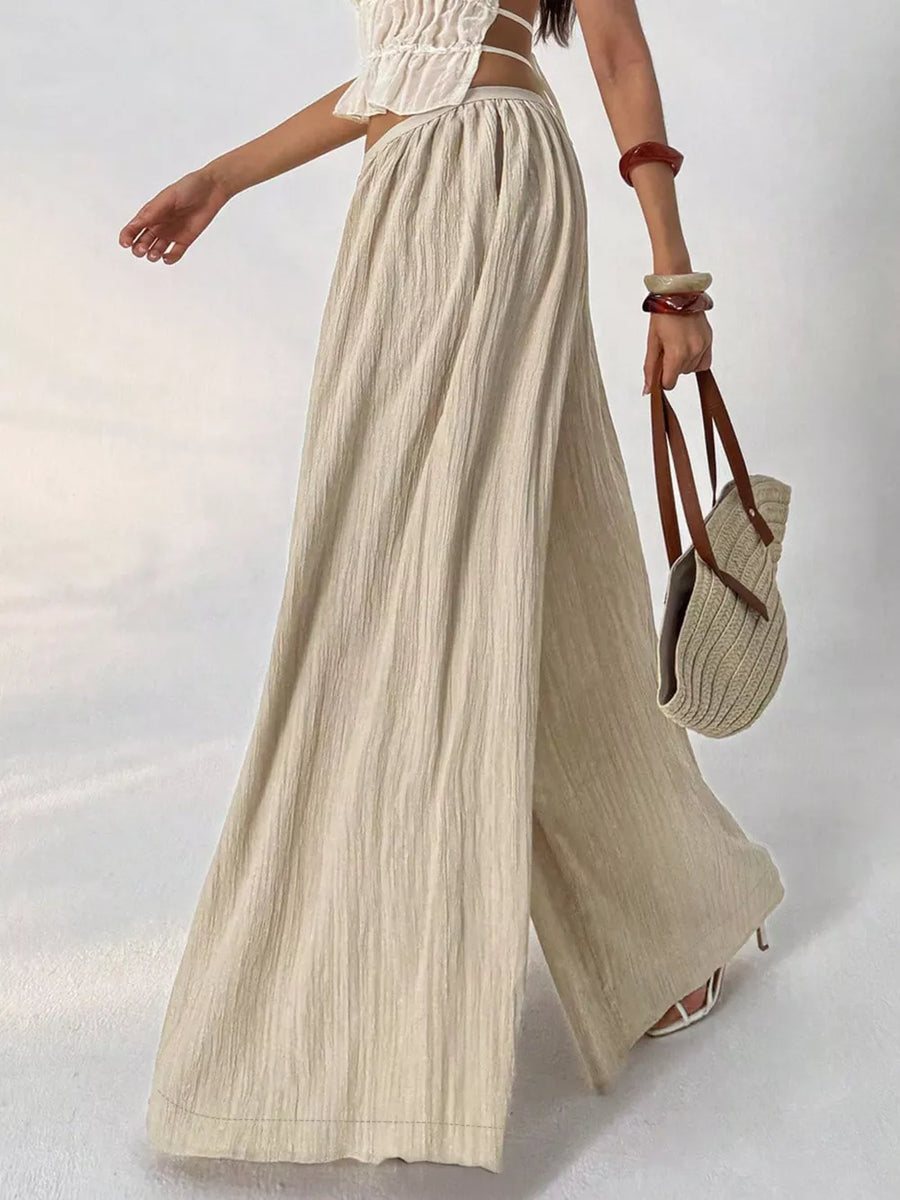 Textured wide-leg maternity pants in beige cotton with a gathered waist.