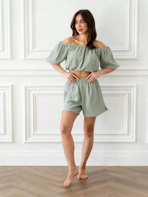 Green cotton off-shoulder cropped top and shorts set with puff sleeves.