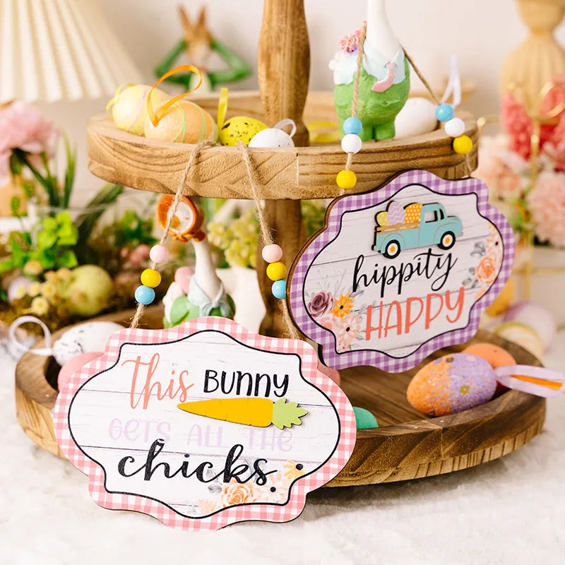 Easter signs with beaded hangers, one reads This Bunny Gets All The Chicks, the other Hippity Happy.