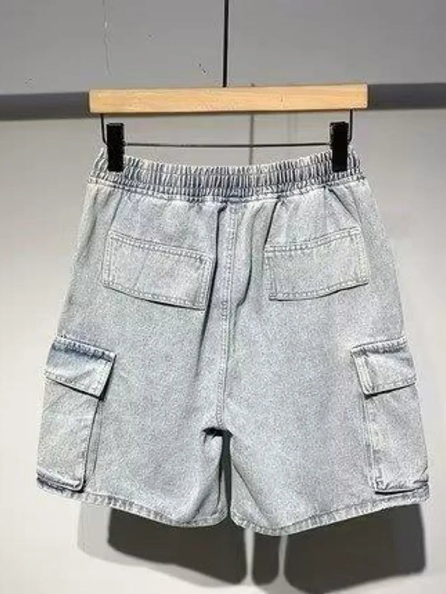 Men's light blue denim cargo shorts with elastic waist and drawstring.