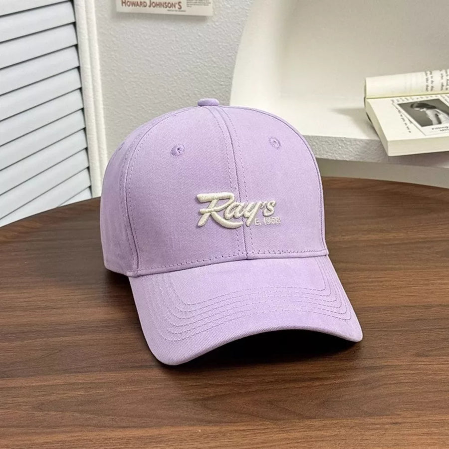 Heliotrope purple baseball cap with white embroidered "Ray's E. 1958" text.