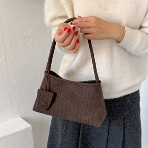 Brown shoulder bag featuring woven texture and woven