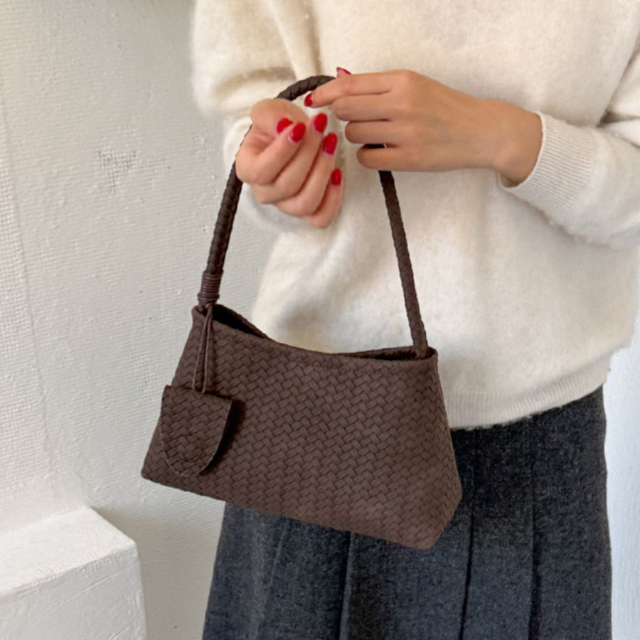 Brown shoulder bag featuring woven texture and woven